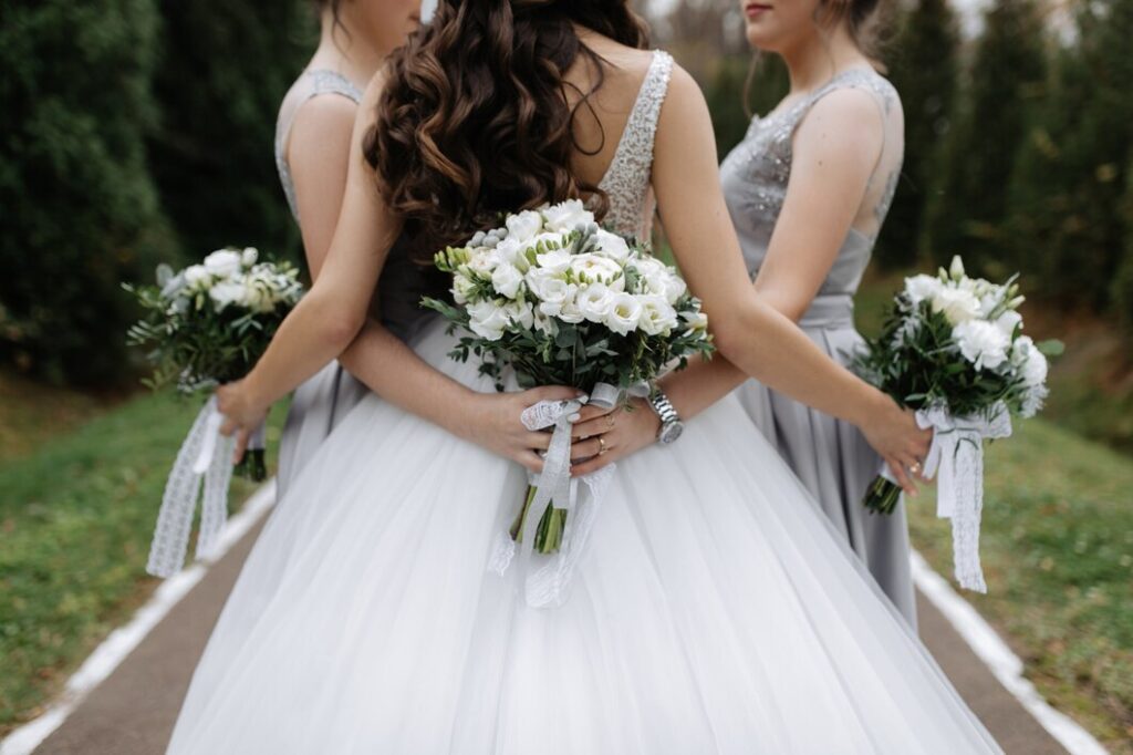 Back of a bride and bridesmaids